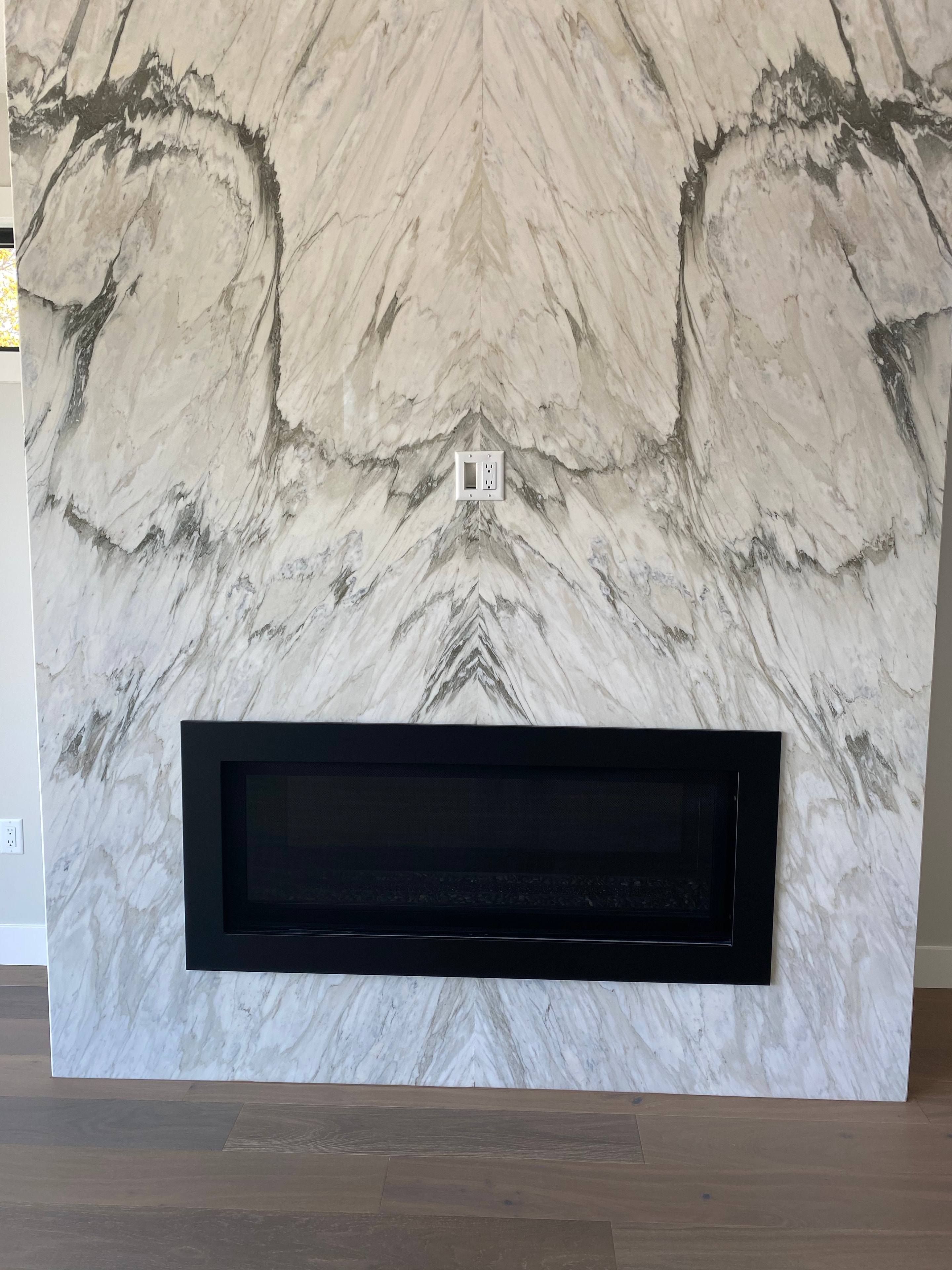 Trout Creek Residence — marble feature wall with linear fireplace