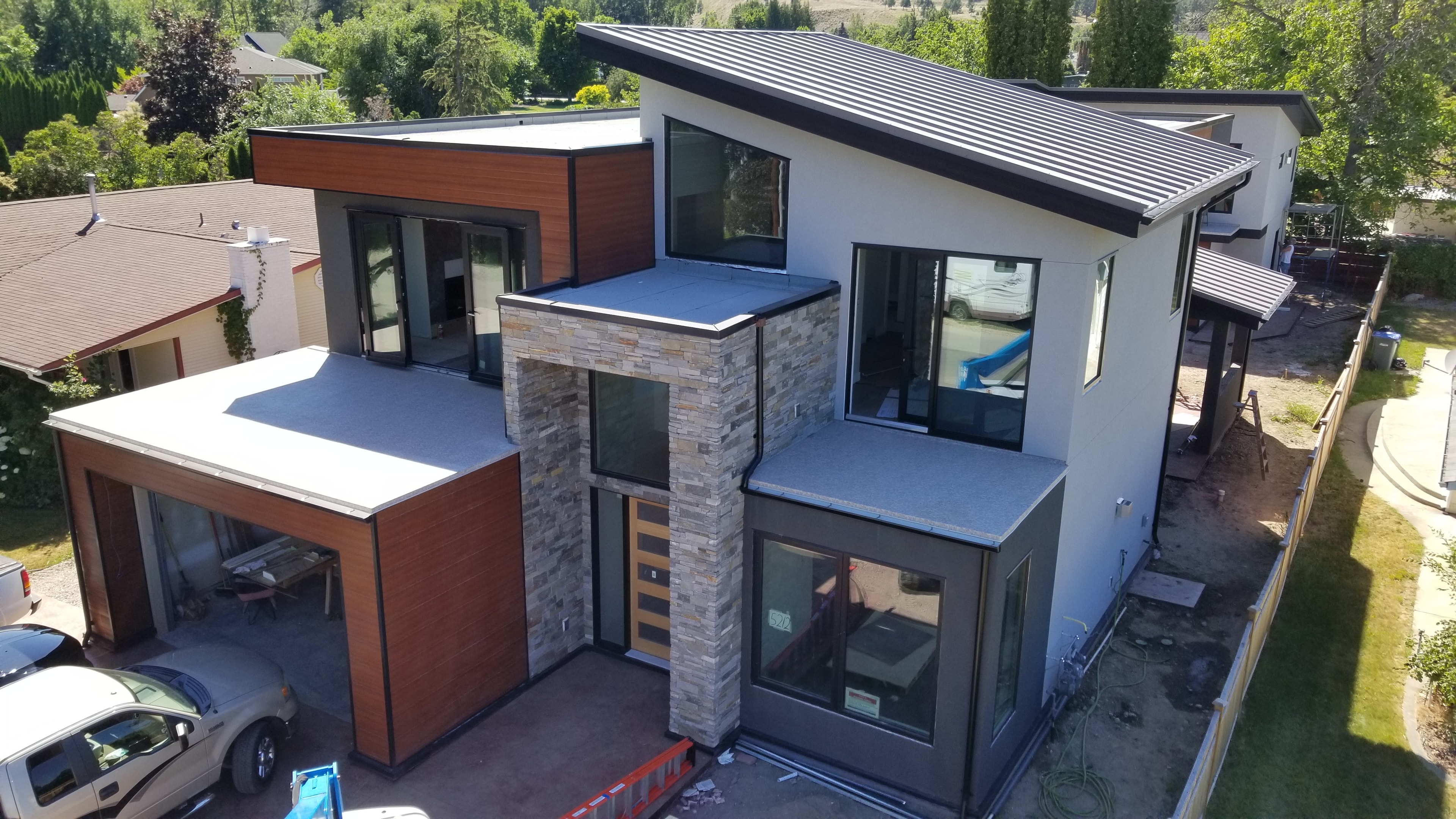 Trout Creek Residence — aerial view showing roofline and stone cladding